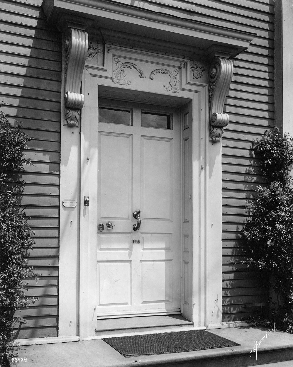 Black and white photo of front door at 105 Brattle Street.