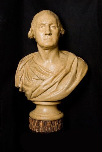 Tan colored bust of President Washington.
